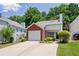 Home with attached garage, and lush, mature trees in a well-maintained neighborhood at 2507 Albion Farm Way, Duluth, GA 30097