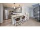 Eat-in kitchen featuring stainless steel appliances, grey cabinets, and a granite countertop at 2507 Albion Farm Way, Duluth, GA 30097