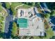 Aerial view of the skate park with parking, landscaping, and a covered shelter at 2628 Amberly Dr, Dunwoody, GA 30360