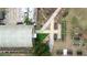 Overhead view of community garden featuring raised beds, greenhouse, and paved pathways at 2628 Amberly Dr, Dunwoody, GA 30360