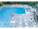 Community pool features lounge chairs, tables, and lifeguard stands at 2628 Amberly Dr, Dunwoody, GA 30360