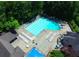 Overhead shot of a large rectangular swimming pool with lounge chairs and a diving board, perfect for summer days at 2628 Amberly Dr, Dunwoody, GA 30360