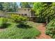 Expansive backyard featuring a deck and screened porch, perfect for outdoor entertaining and relaxation at 3802 Sw Knights Bridge Sw Rd, Lilburn, GA 30047