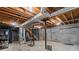 Unfinished basement with exposed ceiling, concrete floor, and block walls, offering potential for customization at 3802 Sw Knights Bridge Sw Rd, Lilburn, GA 30047