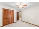 Bedroom featuring a ceiling fan, closet and neutral carpet at 3802 Sw Knights Bridge Sw Rd, Lilburn, GA 30047