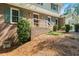 Lovely home features a brick front and attached garage nestled in a wooded area at 3802 Sw Knights Bridge Sw Rd, Lilburn, GA 30047