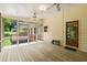 Relaxing screened porch featuring ceiling fans and views of the deck and backyard at 3802 Sw Knights Bridge Sw Rd, Lilburn, GA 30047