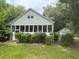 Charming bungalow-style home with a sunroom and detached garage at 602 Hamilton Holmes Dr, Atlanta, GA 30318