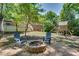 Backyard firepit area with comfortable seating and playhouse, ideal for Gathering gatherings and relaxation at 1448 Diamond Head Cir, Decatur, GA 30033
