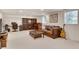 Spacious finished basement with a cozy seating area, desk, and piano at 1448 Diamond Head Cir, Decatur, GA 30033