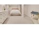 Basement featuring a bed, dresser, chair, and dollhouse, offering versatile living options at 1448 Diamond Head Cir, Decatur, GA 30033