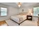 Cozy bedroom with a chandelier, neutral decor, and plenty of natural light at 1448 Diamond Head Cir, Decatur, GA 30033