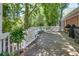 Relaxing backyard deck featuring a hammock, bench seating, and a grill for outdoor cooking at 1448 Diamond Head Cir, Decatur, GA 30033