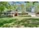 Charming ranch-style home featuring a brick facade, mature landscaping, and a well-maintained front yard at 1448 Diamond Head Cir, Decatur, GA 30033
