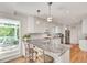 Well-lit kitchen with white cabinetry, stainless steel appliances, granite countertops, and an adjacent deck at 1448 Diamond Head Cir, Decatur, GA 30033