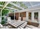 Outdoor patio under a pergola, furnished with a dining table and chairs at 1448 Diamond Head Cir, Decatur, GA 30033