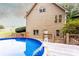 Backyard view featuring an above-ground pool with a wooden deck and stairs, perfect for relaxation at 200 Scouts Ridge Dr, Covington, GA 30016
