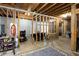 Unfinished basement space with exposed wooden beams, ready for custom finishes and ample storage at 200 Scouts Ridge Dr, Covington, GA 30016