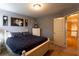 Comfortable bedroom boasts a queen-sized bed, neutral walls, and easy access to the hallway at 200 Scouts Ridge Dr, Covington, GA 30016
