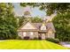 Charming stone and shingle home with manicured lawn and mature trees at 200 Scouts Ridge Dr, Covington, GA 30016