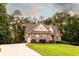 Well-maintained home featuring a stone facade and a long driveway at 200 Scouts Ridge Dr, Covington, GA 30016