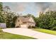 Home with large paved driveway and an attached two-car garage at 200 Scouts Ridge Dr, Covington, GA 30016