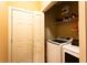 Laundry room featuring a modern washer and dryer with access to storage area at 200 Scouts Ridge Dr, Covington, GA 30016