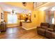 Open living space with wood floors, a vaulted ceiling, and natural light from the windows at 200 Scouts Ridge Dr, Covington, GA 30016