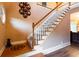 Traditional staircase with carpeted steps and a wooden banister at 200 Scouts Ridge Dr, Covington, GA 30016
