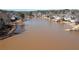 Aerial view of the lake showing surrounding homes in the community at 251 Waterford Cove Dr, Suwanee, GA 30024