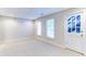 Spacious carpeted basement featuring a white door leading to an outdoor staircase at 251 Waterford Cove Dr, Suwanee, GA 30024