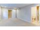 Large, finished basement area with carpet, access to bathroom and other rooms at 251 Waterford Cove Dr, Suwanee, GA 30024