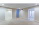 Finished basement featuring neutral carpet, recessed lighting, and plenty of open space with three access doors at 251 Waterford Cove Dr, Suwanee, GA 30024
