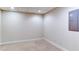 Neutral carpeted basement space with recessed lighting and access panel at 251 Waterford Cove Dr, Suwanee, GA 30024