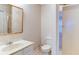 Bathroom with marble-topped vanity, toilet, and glass-enclosed shower at 251 Waterford Cove Dr, Suwanee, GA 30024