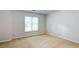 Empty bedroom featuring a large window providing lots of natural light at 251 Waterford Cove Dr, Suwanee, GA 30024