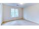 Empty bedroom featuring a large window providing lots of natural light at 251 Waterford Cove Dr, Suwanee, GA 30024