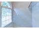 Walk-in closet featuring an arched window that lets in natural light at 251 Waterford Cove Dr, Suwanee, GA 30024