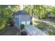 Exterior view of the home with attached garages, wooden deck, and landscaped yard at 251 Waterford Cove Dr, Suwanee, GA 30024