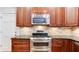 Close up of kitchen with stainless steel oven and microwave and lots of cabinet space at 251 Waterford Cove Dr, Suwanee, GA 30024