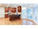 Well-equipped kitchen featuring stainless steel appliances, granite countertops, and a breakfast bar at 251 Waterford Cove Dr, Suwanee, GA 30024