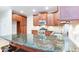 Kitchen featuring stainless steel appliances, granite countertops and dark wood cabinets at 251 Waterford Cove Dr, Suwanee, GA 30024