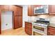 Kitchen with stainless steel oven and microwave, with lots of cabinet space for storage at 251 Waterford Cove Dr, Suwanee, GA 30024