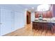 Kitchen featuring stainless steel appliances, dark wood cabinets and a breakfast bar at 251 Waterford Cove Dr, Suwanee, GA 30024