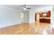 Open-concept living space flowing into the kitchen with hardwood floors and ample natural light at 251 Waterford Cove Dr, Suwanee, GA 30024