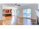 An open floor plan connects the living room with fireplace to the kitchen with bar stool seating at 251 Waterford Cove Dr, Suwanee, GA 30024