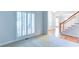Living room features include shutters on the windows, light gray walls, and carpeted floors at 251 Waterford Cove Dr, Suwanee, GA 30024