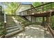 Backyard view featuring a walkout basement, exterior stairs and a deck at 2935 Leafwood Se Dr, Marietta, GA 30067