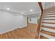 Bright basement with wood-look floors and stairwell with wood treads and white risers at 2935 Leafwood Se Dr, Marietta, GA 30067
