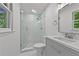Updated bathroom features a glass-enclosed shower with subway tile and a modern vanity at 2935 Leafwood Se Dr, Marietta, GA 30067